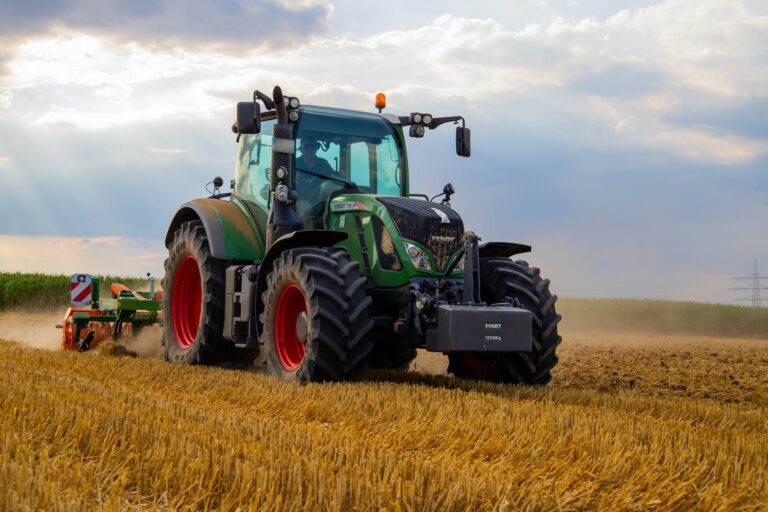 tractor ploughing conventional agriculture farm